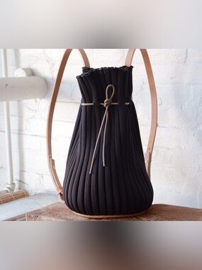 Hoi Bo Exhale Supernova Knit Pleated Backpack – Black and leather straps